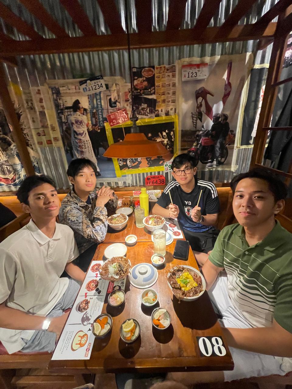 Ivan and friends over rice bowls at a Japanese diner